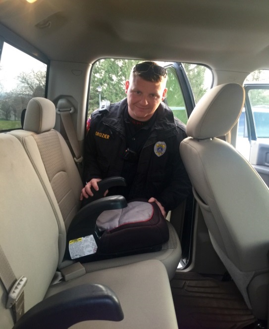 Officer Grozier inspecting a car seat