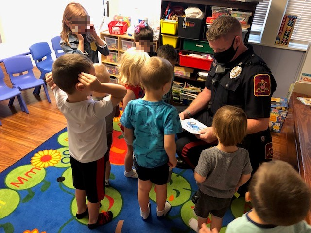 Officer Grozier reading to children